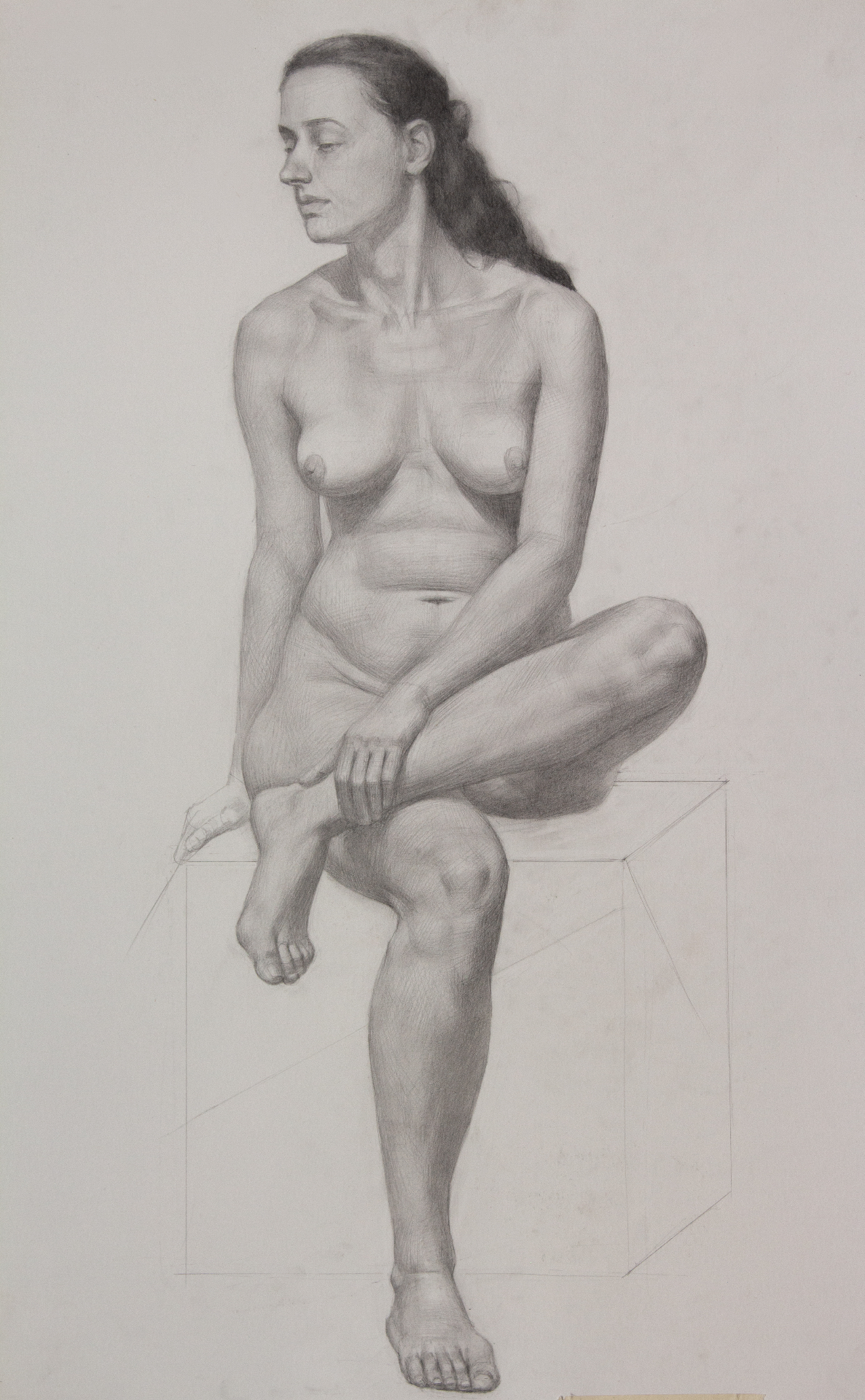 Seated figure on cube